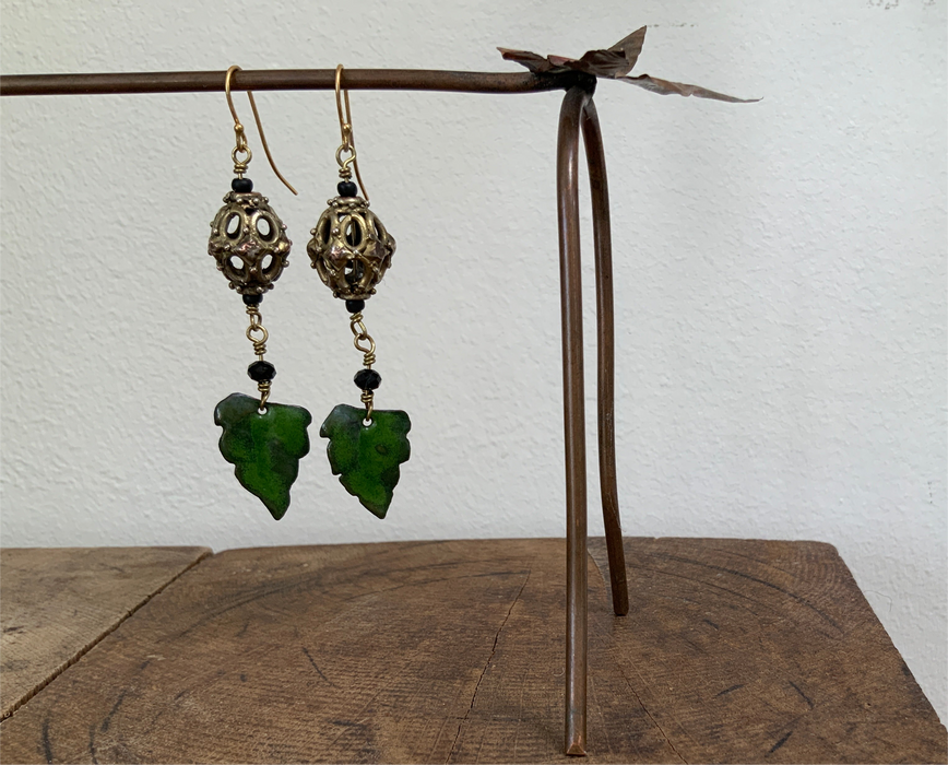 Earrings with gold plated brass/copper bead and green enamel leaf