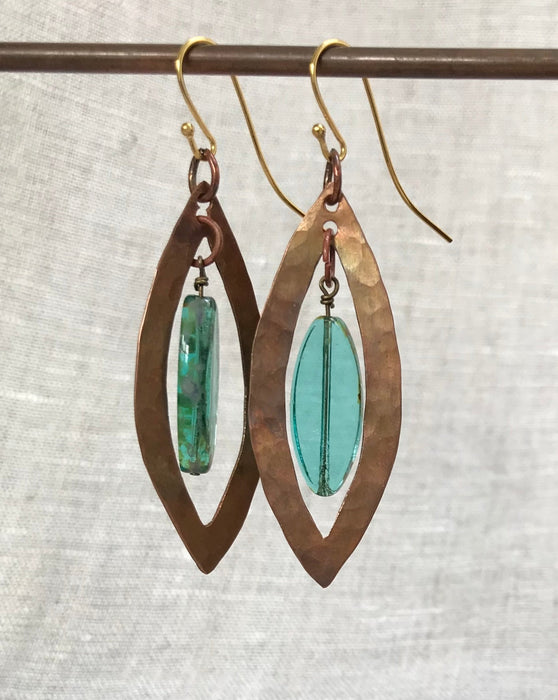 Eye-shaped copper earrings with turquoise glass beads